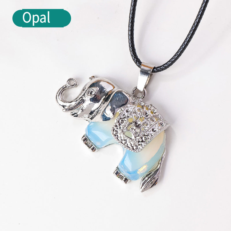 RYS Necklace with a pendant in the form of a baby elephant made of natural crystal and rough stone
